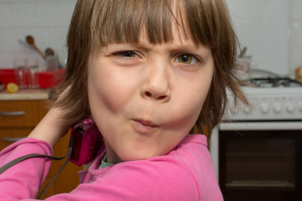 Portrait of a young girl with stomach pain.