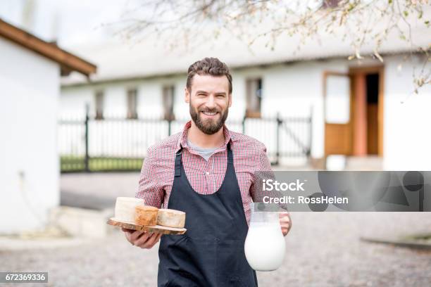 Farmer With Milk And Cheese Outdoors Stock Photo - Download Image Now - Cheese Making, Farmer, Cheese