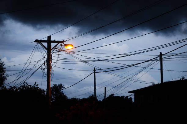 istock Street light at night with a stormy sky background 672369352