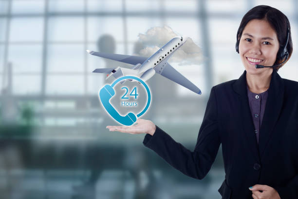 istock sales person asia happy smiling plane flight travel for customer support operator with headset 24 hours in office. 672372532