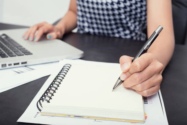 istock business hand writing on notebook to do list. concept organizer management reminder. 672372578