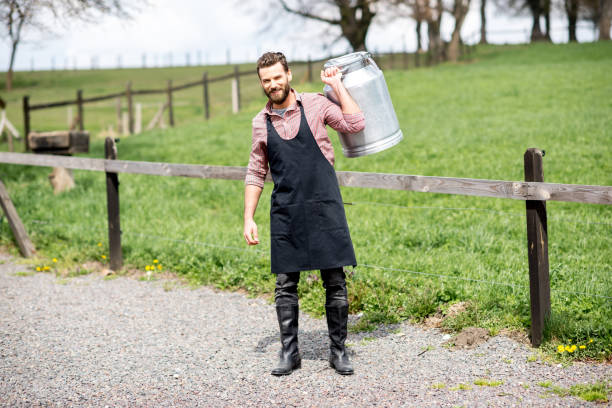 istock Farmer with milk outdoors 672372580