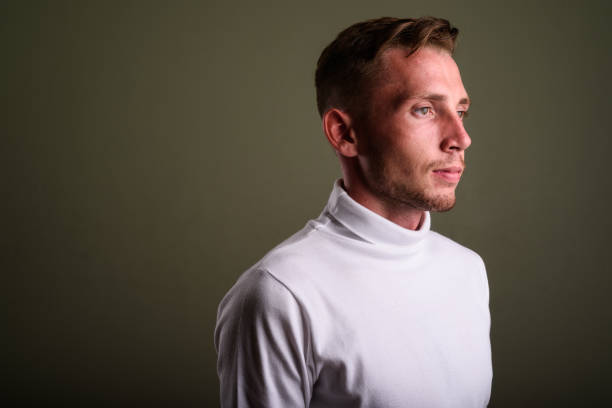 istock Studio shot of young man against colored background 672373572
