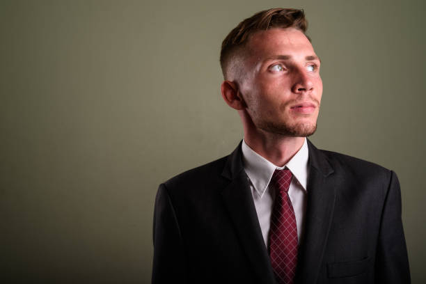 istock Studio shot of young businessman against colored background 672373758