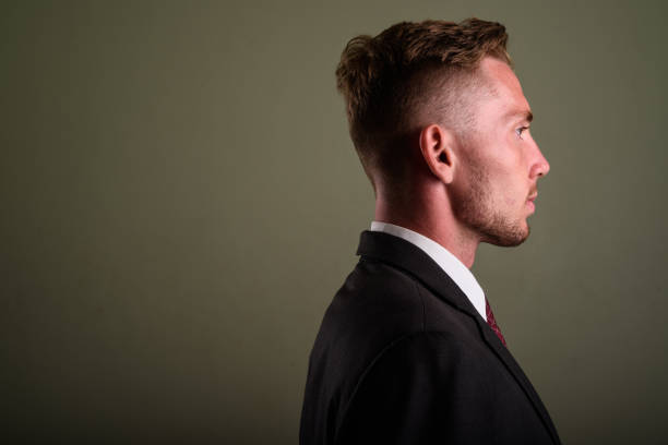 istock Studio shot of young businessman against colored background 672373876