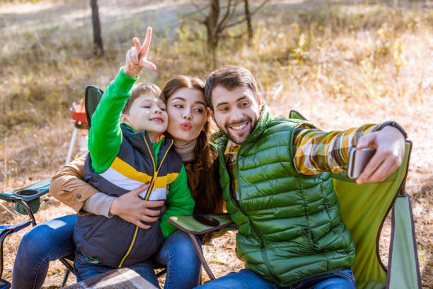istock Happy family taking selfie 672376312