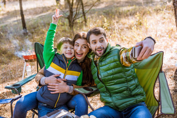 istock Happy family taking selfie 672376454