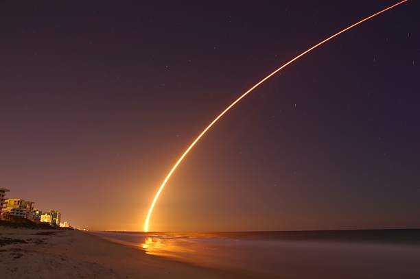 Rocket launch at night. Space rocket launch from Cape Canaveral launch tower stock pictures, royalty-free photos & images