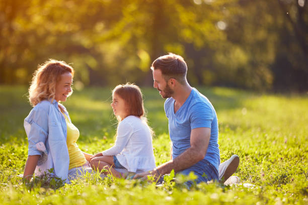 istock Family together in green nature 672381274