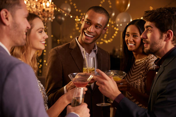 istock Group Of Friends With Drinks Enjoying Cocktail Party 672381334