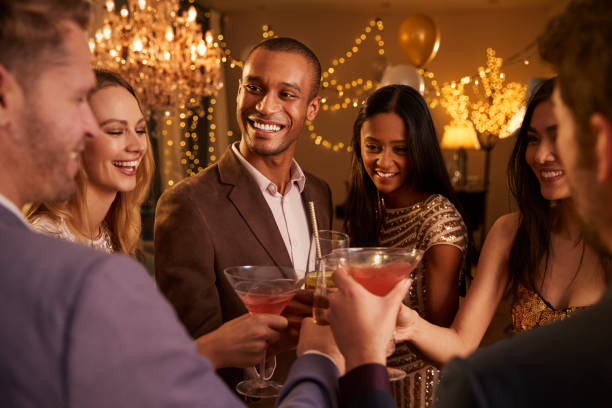 istock Group Of Friends With Drinks Enjoying Cocktail Party 672381340