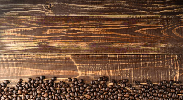 istock coffee beans on table brown wood 672383054