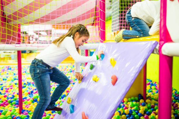 istock Little girl playing on playground 672386662