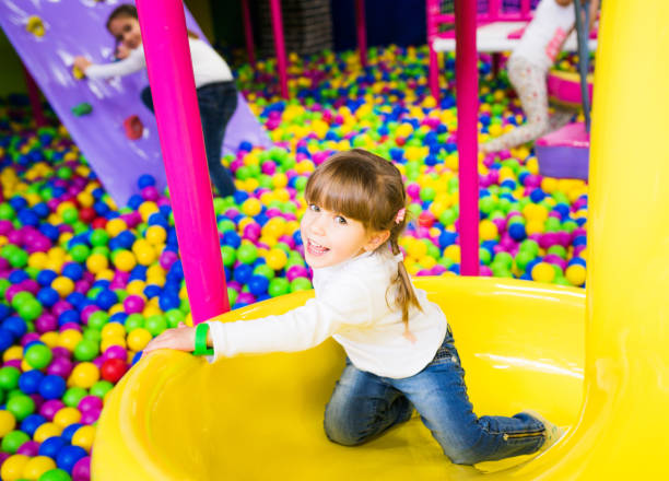 istock Little girl playing on playground 672387814