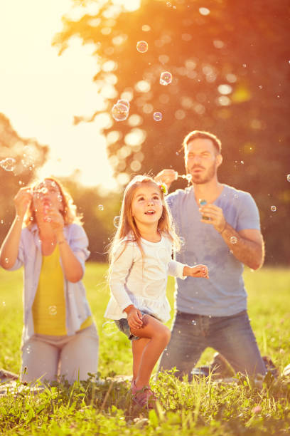 istock Entertainment for child with shinny soap bubbles 672390474