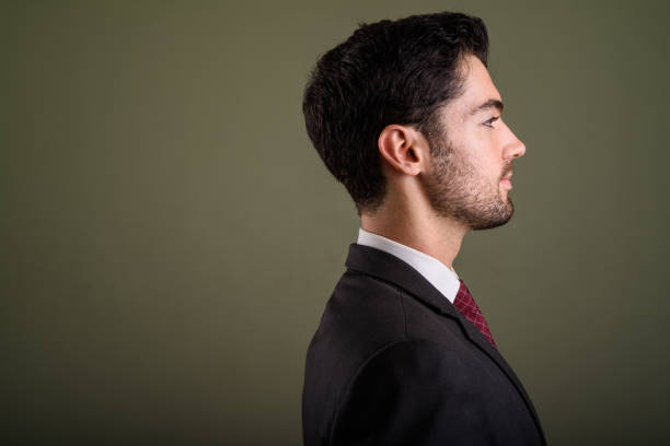istock Studio shot of young handsome businessman against colored background 672390550