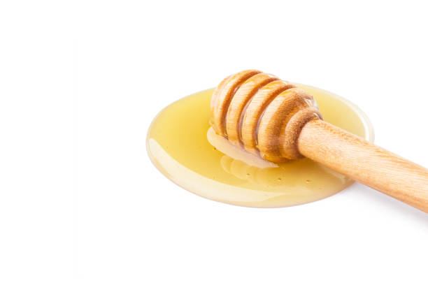 istock honey isolated on white background. Ready to use with clipping path and copyspace 672390752