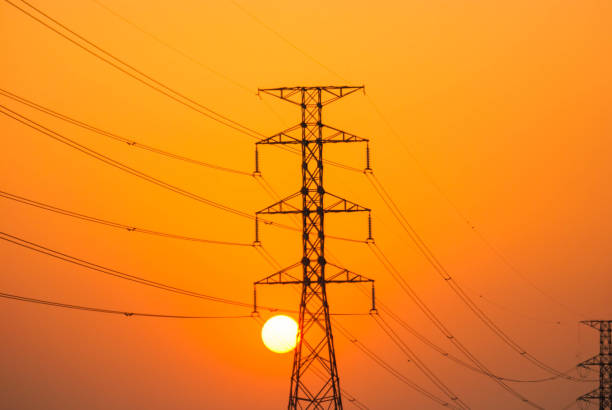 istock High voltage towers and sunset at night. 672391202