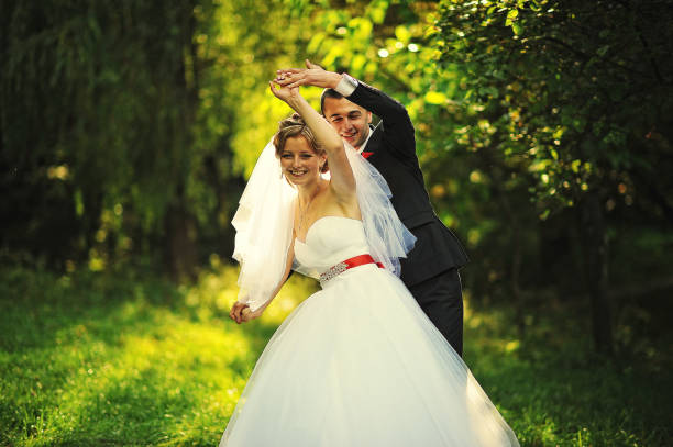 istock Young and gorgeous wedding couple on autumn forest 672394086