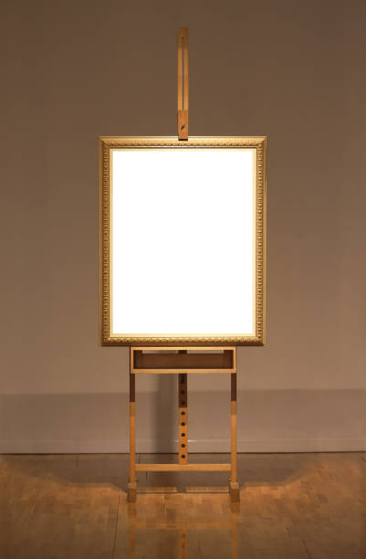 istock Blank art frame on wooden easel in museum 672397548