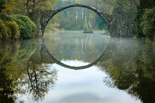 19th-century bridge Rakotzbrücke (also called the Devil's Bridge) uses its reflection to form a perfect circle