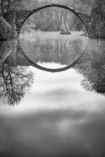 19th-century bridge Rakotzbrücke (also called the Devil's Bridge) uses its reflection to form a perfect circle