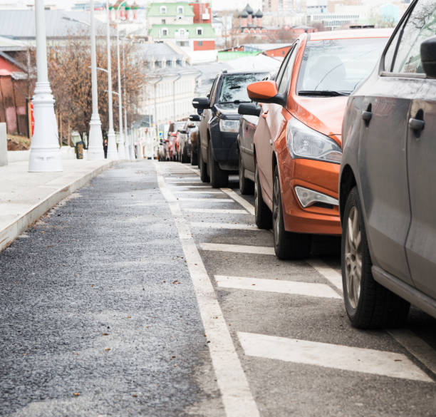 istock Parked in a row cars 672406346