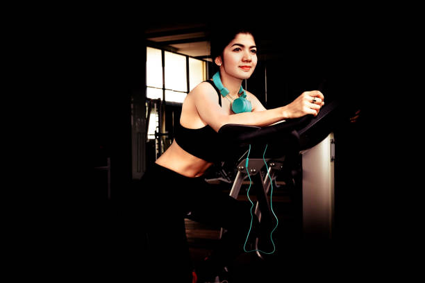 istock Woman exercise in gym. 672411294
