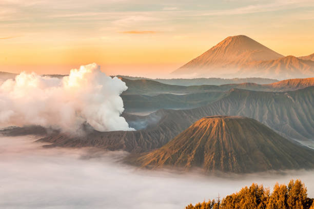 istock Mount Bromo volcano, Batok and Semeru (Mt.) during sunrise 672411952