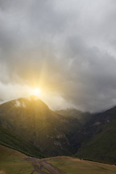 istock ountain panoramic view on a evening. Beautiful evening mountain landscape under bright sunset. Georgia Kazbegi 672412388