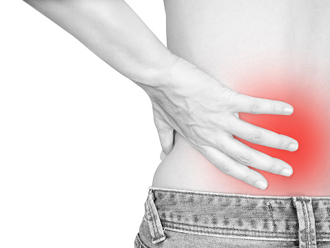 Woman with lower back pain isolated on white background (with clipping path)
