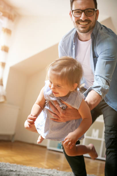 istock Father spending time with his little baby at home. 672414878