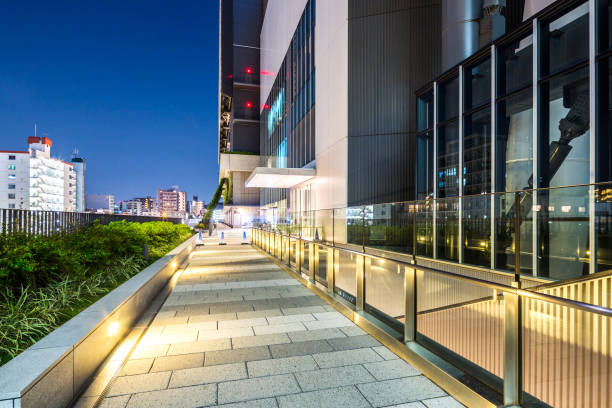 istock empty footpath outside of modern building at night 672416346