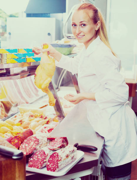 istock woman selling fresh chicken 672418516