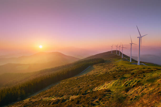 Free Stock Photo of Sunset over rolling hills with wind turbines ...