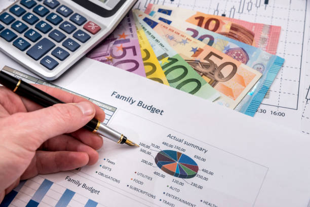 istock Euro currency on paper background with chart. 672430046