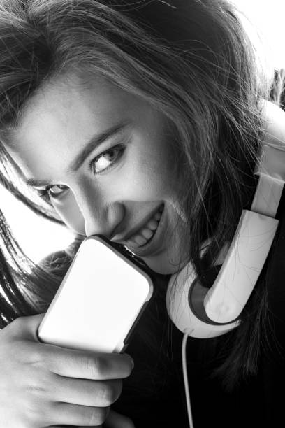 istock stylish Woman using smartphone 672436360