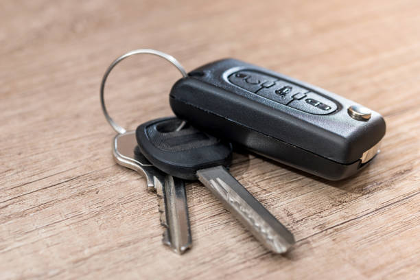 black car key on wooden desk with copy space.