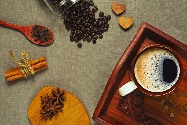 istock Espresso coffee on tray and spices on textile 672444804