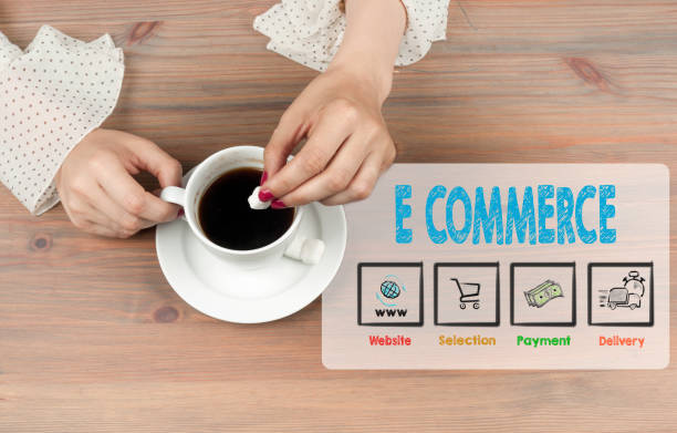 istock E commerce. Coffee cup top view on wooden table background 672446140