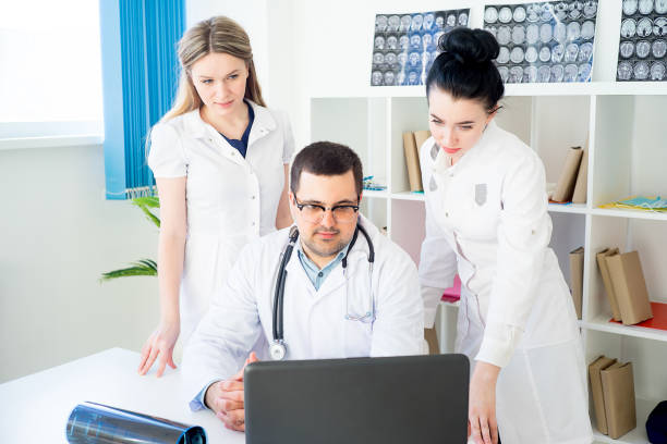 istock Team of doctors at working place 672449998