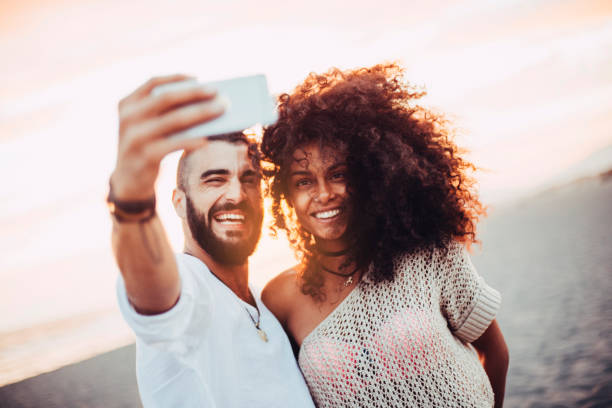 istock Lovely couple making a selfie 672450334