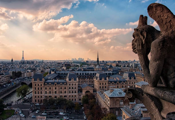 istock Notre-Dame's gargoyle in Paris panorama 672458274