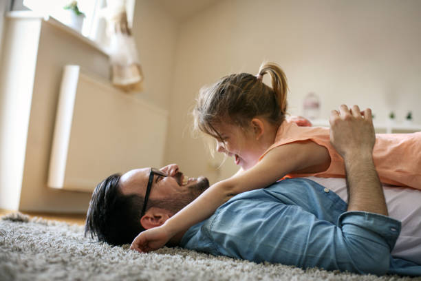 istock Happy father playing at home with his daughter. 672459232
