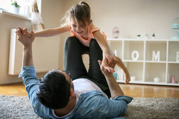 istock Happy father playing at home with his daughter. 672459246