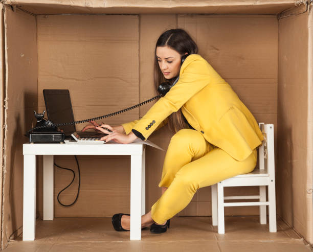 istock business woman talking on the phone and checking e-mail 672459576