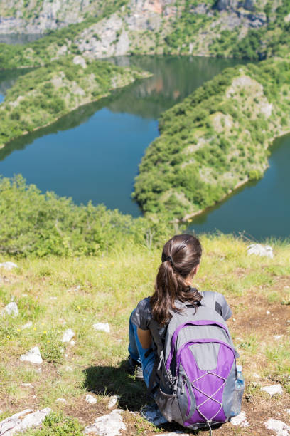 istock Young Woman Overlooking Canyon 672459794