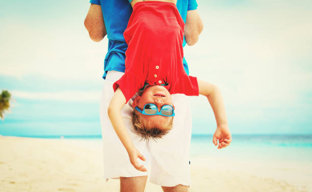 istock father and little son playing at sky 672465658