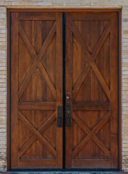 Rustic Double Wooden Door Rustic Double Wooden Door on brick building rustic door stock pictures, royalty-free photos & images