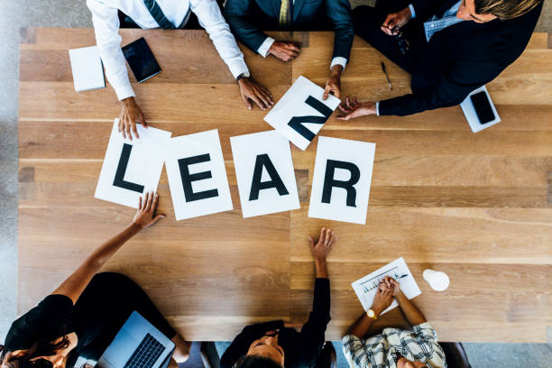 istock Business team meeting with word Learn on table 672470208
